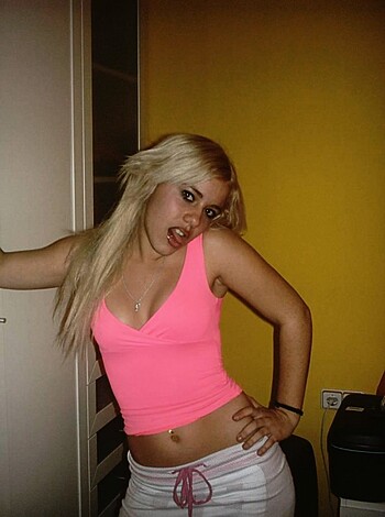 "Here's a young, hot babe in a pink shirt flipping the bird and posing with her thumb up her tight ass crack."