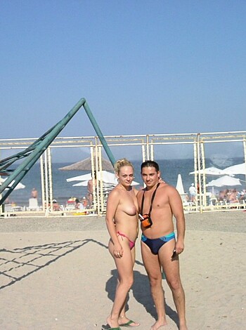 "Here's a shot of two dicks and some tits on the fucking beach."