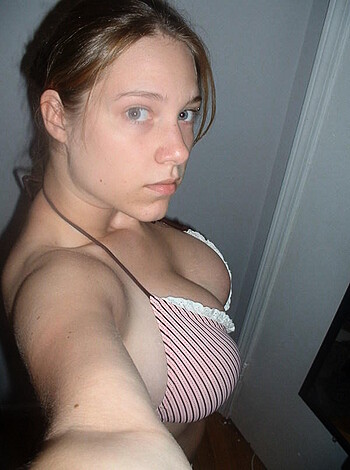 This image shows some hot chick with a tight ass in a tiny red-and-white bikini, flaunting her shit for the fucking camera.