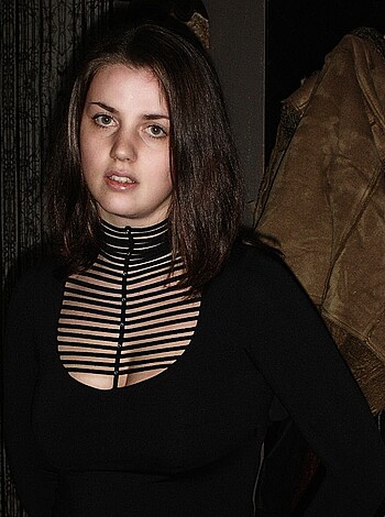 """
Look at this fucking hot chick in that sexy fucking dress with those cutout holes and that fucking high-necked top, exposing her tits for all the world to see. Fuck yeah!
