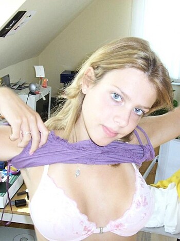 F*ck me, this bitch needs to clean up her shitty fuckin' room! Look at the pile of laundry and shit on the floor, while she's playin' with her tits like some kinda dirty slut. She must be a fucking mess in the sack too, judging by those saggy tits of hers!