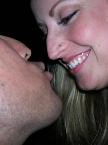 A bangin' shot of a hot babe suckin' face with her dick-riding boyfriend, tonguing his fuckin' cheek.