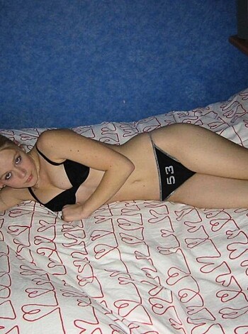 "A naked bitch lying on some fucking bed."