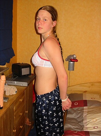 Here's the topless bitch, wearing her fucking pink pajamas like she gives a shit.