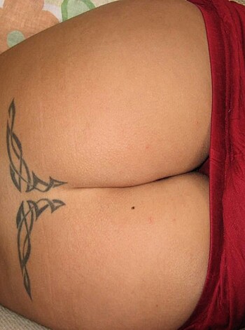 """
Rear end with tatted ass on display.
"""