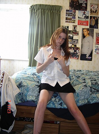 """
A bitch is flashing her titties and giving the finger to the lens.
"""