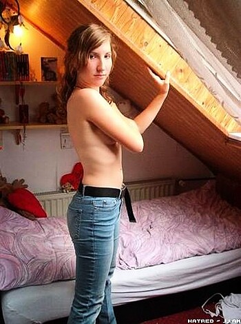 A hot babe, legs spread wide open, leaning against the fucking ceiling of her goddamn shitty apartment.