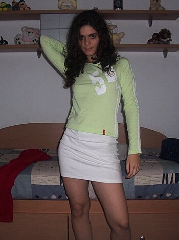 """
This photo shows a hot babe with no bra or panties on, her fucking tits hanging out of that thin shirt. Oh my god! She's gotta be so fucking wet right now, and I bet she's ready to take any dick that comes near her. Damn, look at those thick thighs and juicy pussy lips. This chick is perfect for getting wild and dirty. Whoever takes her home tonight is in for one hell of a ride."""