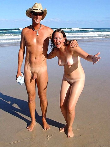 Here's a goddamn picture of some naked fucking couple cracking up on the sandy shore like a pair of horny bastards, you filthy sonofabitch.