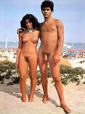 A couple of fucking naked asses basking in the sun on the sandy shoreline.
