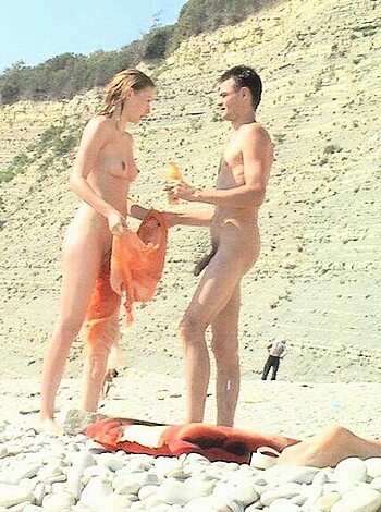 F**k me running, these two naked bastards are checking out each other's genitals on the goddamn beach!