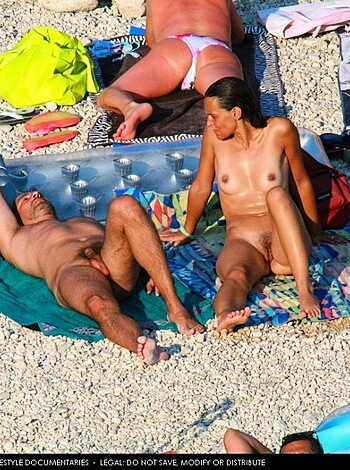 "Here's a shot of some chick and dude getting their freak on, nude as fuck on the sand."