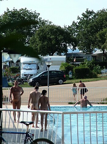 A bunch of nude folks frolicking in the swimming pool can be seen in this picture.

Or

Here's a bunch of freaking naked individuals having a ball in the goddamn swimming pool, for Christ's sake!