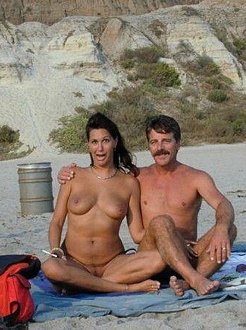 A pair of horny fuckers getting their jollies by making out on the sandy shore, completely nude and fully exposed.