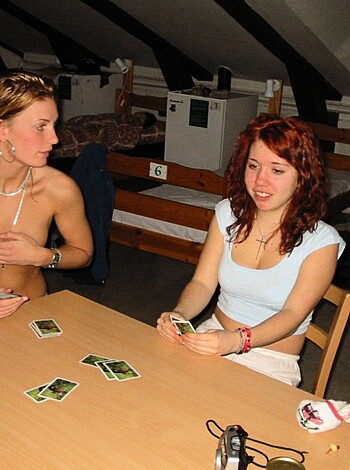 "Busty blonde tits out, chatting about poker."