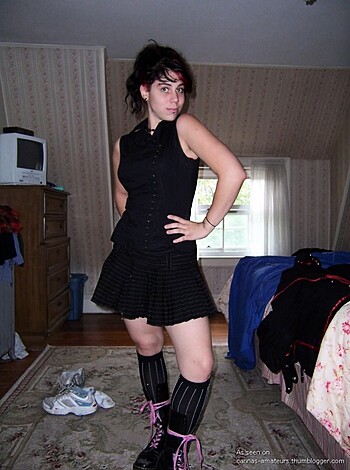 Thigh-high boot slut is dressed in fishnets, short skirt and a tight corset showing off her perky tits.