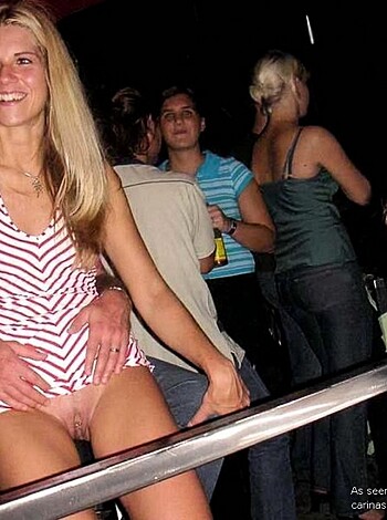 The picture shows a fat woman with a red-and-white bikini, while some guy is bent over, laughing his fucking head off because of her bloated belly and thunder thighs.