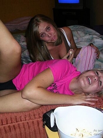 "Yo, check out these two chicks spreadin' 'em legs wide open like they fuckin' love it. Bitch on the left got that pussy in the air with her dicksuckin' friend starin' right at it, hahaha."