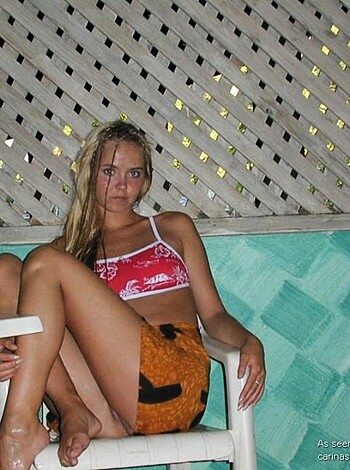 Fucking hot piece of ass chick in a skimpy bikini, sitting on a chair by the swimming pool with her perfect tits hanging out and her shit-stained thong showing off her pussy.