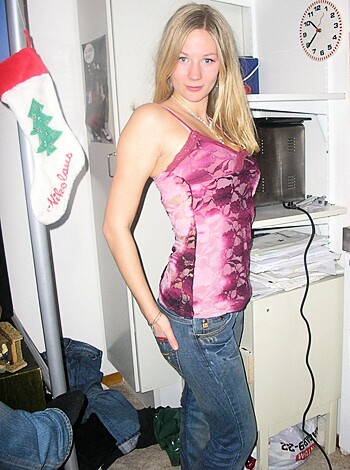 "Fuck, this hot bitch is showing off her tits and ass for the lens. Get a load of those perky nipples poking through that tight dress."
