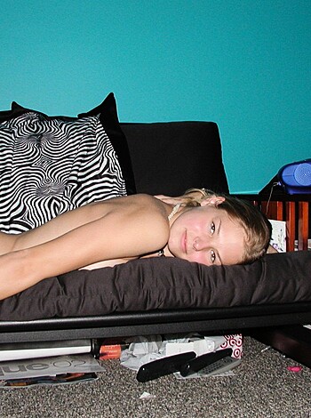 Here's a fucking picture of some nude bitch laid out on a couch, just chillin' with her tits and pussy in full view for all you sick motherfuckers to enjoy.