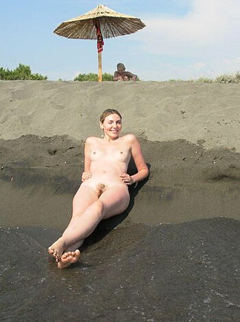 "Busty blonde bitch sunbathes on a fucking beach with her giant tits and an umbrella while flashing that shit-eating grin for the camera."