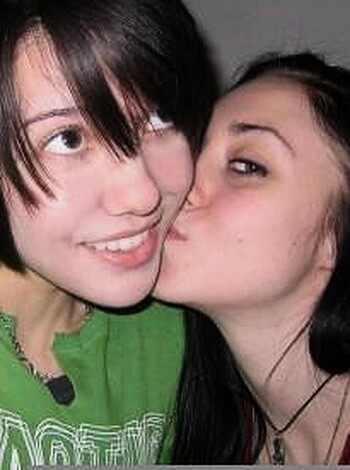 Two chicks sucking face.