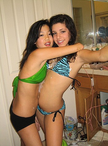 "Two fucking hot chicks sucking on each other's tits while taking a sexy selfie."