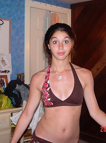 "Bitch stripping down to her skimpy bikini, showing off her tits and ass while she opens her fat cock-sucker lips for a big gob of saliva."