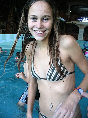 Look at this hot young chick in a bikini sunbathing by the pool while having the time of her life.