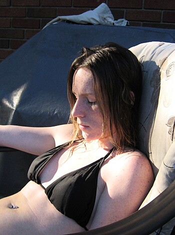 "Chick in a bikini fuckin' rocks the chair seat with her smoking hot, tanned ass while gettin' some much needed rays."