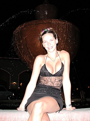 "Here's a hot, busty babe, titties out, sittin on a pissing fountain."
