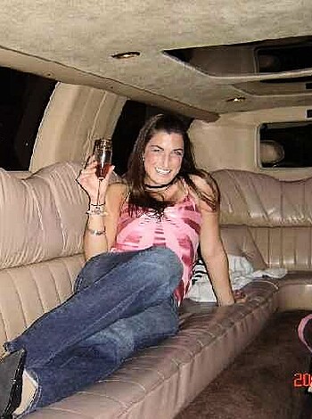 "Check out this hot bitch in a fancy ass ride, chugging back some bubbly while flashing the wine glass."