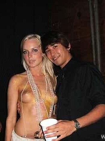 Vulgar description:
 "Look at this fucking bitch with her tits hanging out, showing off her slutty necklace."