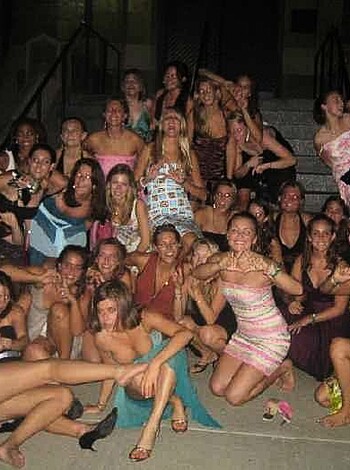 Here's a 29-word vulgar description of the image: "Twenty hoes in tight dresses and heels, showin' off their tits and ass while grinnin' like they just fucked the whole damn room."