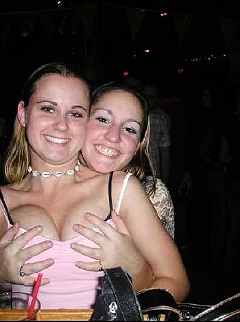 "Two tits-out whores engage in homoerotic smothering session."