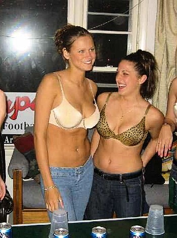 Six sluts in skimpy outfits, fucking around at some shithole bar at night, acting like they're hot shit.