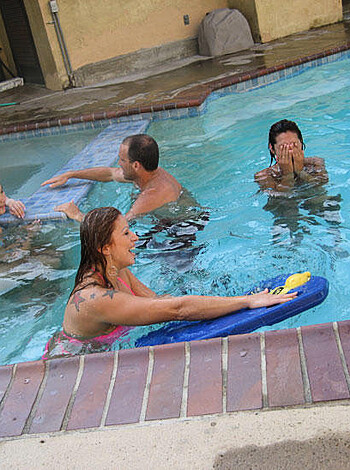 Vulgar description: "Fuckin' hot bitches sunbathin' naked by the fuckin' pool while their dudes crack open a cold one. Fuckin' party time, motherfucker."
