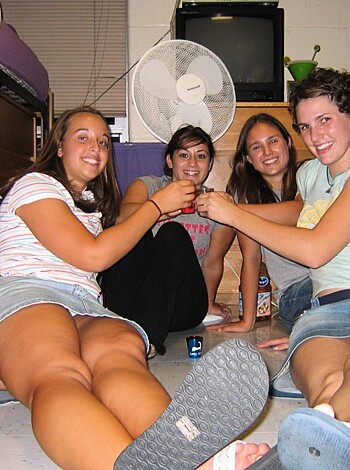 Vulgar description: "Check out these four hot chicks getting wasted and grinning like fucking idiots."