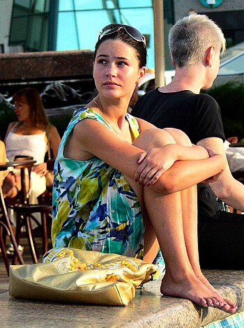 "Here's a picture of some barefoot bitch with her legs crossed."