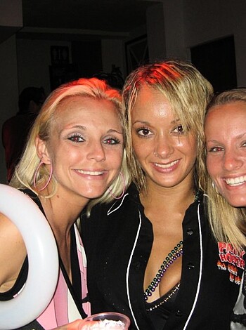 Three chicks having a ball, laughing and flirting with dick.