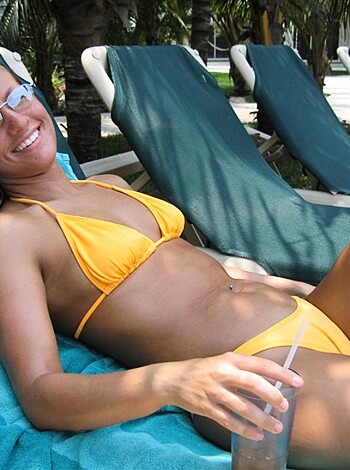 """
Hot nude blonde lying on a sun lounger, showing off her tits and ass.
"""