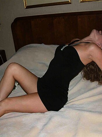 A nude bitch lying on some fucking bed.