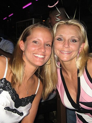 "
Two bitches grinning with their teeth, cunts.