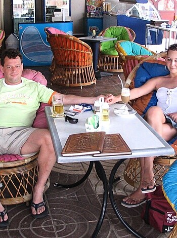 Two fucking adults sittin' side by side on some goddamn chairs.