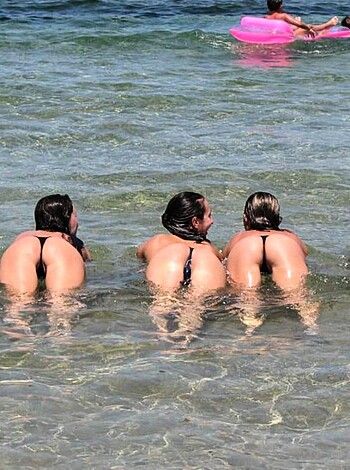 The fucking girls in bikinis are sitting in a goddamn pond or lake or whatever, probably staring at some prick who ain't even there for our viewing pleasure.