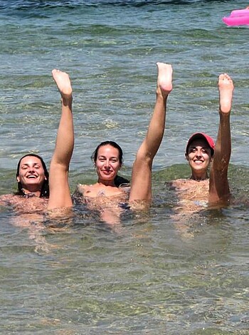A bitches in a swimming pool with their asses up in the air, flippin' out like they own the damn place.