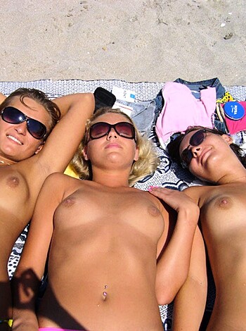"Fucking hot chicks tits out bangin' each other on the fucking sand."