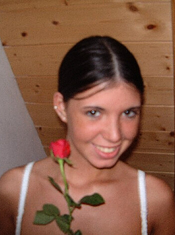"Here's a fuckin' picture of some slutty hoe holdin' up some flower while she got her tits out, lookin' all sexy and shit."