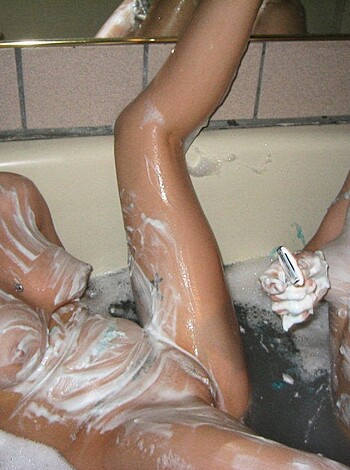 Two Girls are taking a bath and shave your pussy  - Photo 55